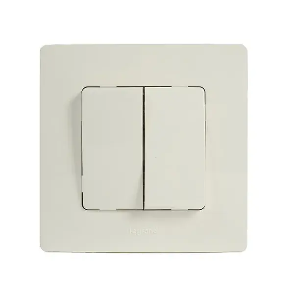 Doble conmutador niloe blanco monbloc legrand
