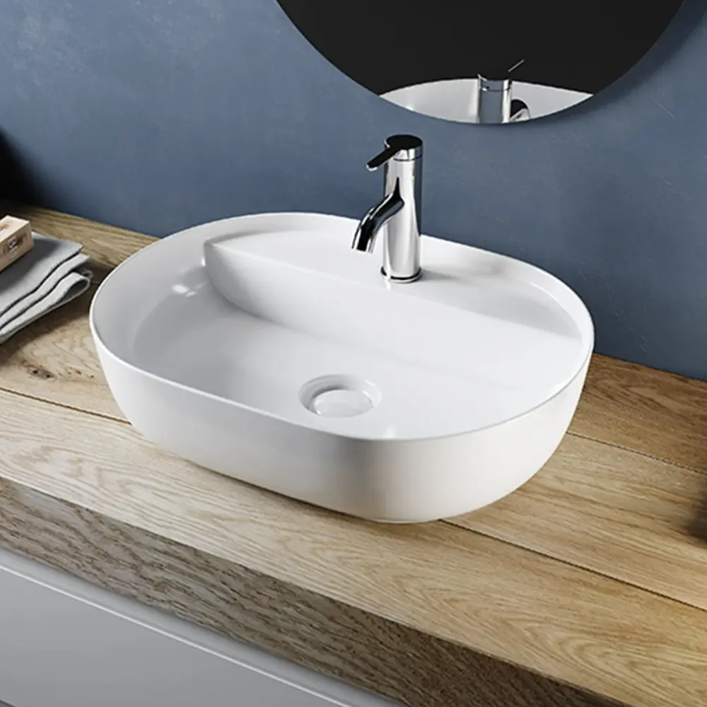 Lavabo da appoggio ovale ceramica bianco lucido serie DRV cm 60,5x40 con foro rubinetto
